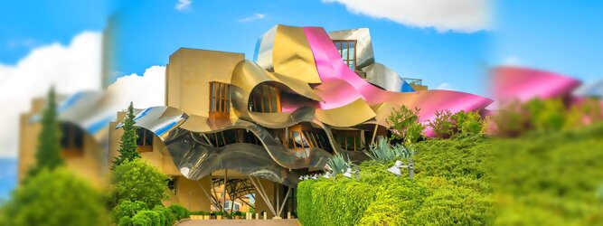Trip Formentera Reisetipps - Marqués de Riscal Design Hotel, Bilbao, Elciego, Spanien. Fantastisch galaktisch, unverkennbar ein Werk von Frank O. Gehry. Inmitten idyllischer Weinberge in der Rioja Region des Baskenlandes, bezaubert das schimmernde Bauobjekt mit einer Struktur bunter, edel glänzender verflochtener Metallbänder. Glanz im Baskenland - Es muss etwas ganz Besonderes sein. Emotional, zukunftsweisend, einzigartig. Denn in dieser Region, etwa 133 km südlich von Bilbao, sind Weingüter normalerweise nicht für die Öffentlichkeit zugänglich.